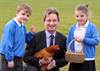 7 year old Jack Castle and 8 year old Ellie Flintoft of Starbeck Community Primary School with the Yorkshire Agricultural Society’s Chief Executive, Nigel Pulling at the breakfast event