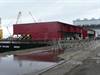Flight deck modules loaded onto a barge at the Port of Liverpool