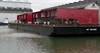 Flight deck modules loaded onto a barge at the Port of Liverpool