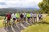 The team makes it to the top of the infamous Box Hill wearing the Going Beyond Gold Medals