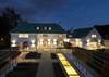 The imposing home boasts elegant external landscaping