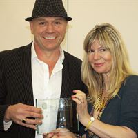 Janey Lee Grace presenting the trophy to Peter Harwood from Qsilica