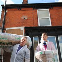 Pictured is Adrian Duffield with son Luke Duffield of Duffield Joinery getting ready to carry out the loft insulation for a landlord of Lighthouse Property Services. They were drafted in by Parr Energy Solutions to help with the insulations
