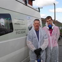 Pictured is Adrian Duffield with son Luke Duffield of Duffield Joinery carrying out the loft insulation for a landlord of Lighthouse Property Services. They were drafted in by Parr Energy Solutions to help with the insulations