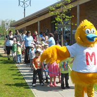 Pictured are staff and children from The Old Station Nursery at Innsworth following Monty the Duck as part of the Meningitis Trust's Toddle Waddle