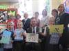 Teachers Mrs Guilmard, Mrs Dart, Mrs Rose, Mrs Parsons, Mrs Smith, Mrs Hoten and Head Teacher Mrs Crompton with (front row) Hamish (6), Anya (5), MP Mark Lancaster and Mia (6)