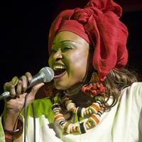 Oumou Sangare Alioune Ba onstage singing close up