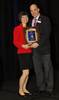 Dr. Penelope Suter accepting A.M. Skeffington Award from COVD President Dr. David Damari