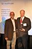 Mr. Ralph Strosin, General Manager, Global Sourcing at GE Healthcare presents Mr. Marty Ignasiak, President of Connectors Unlimited with GE Healthcare’s Supplier Innovation Award. 