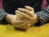 Touching a ring finger to suggest a ring