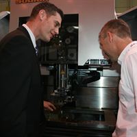l-r Chris Hellyer Sales Manager Sodi-Tech EDM Ltd and Martin Spooner Managing Director Promach 3D agreeing a deal at MACH 2012