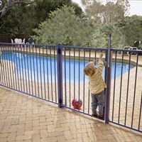 Boy at Pool Fence