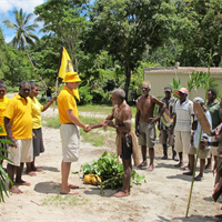 In a traditional ceremony of welcome, Paramount Chief of Savulei welcomes the Scientology Volunteer Ministers to the village of Lambi.