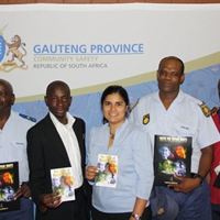 Director of Public Affairs of Church of Scientology of Johannesburg Shaleen Worhnitz (center) with the Church’s Social Programs Officer and members of the Gauteng Provincial Police Social Crime Prevention Program