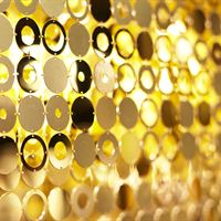 DESIGNLUSH: a closeup of the gold apilletes that inspired the DIFFA table