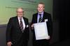 Helmut Claas presents Rob with his award