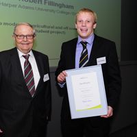 Helmut Claas presents Rob with his award