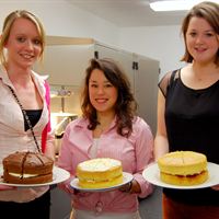 April, Emily and Anna prepare to serve up some cakes