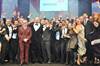 Softcat employees celebrate with Jack Dee upon winning Reseller of the Year