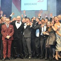Softcat employees celebrate with Jack Dee upon winning Reseller of the Year