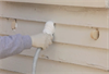 USA Premium Foam insulation is injected into the walls of an existing home from the outside