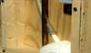 Insulation foam is injected into an existing wall cavity via a tube