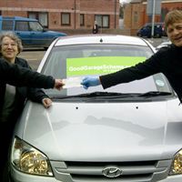 Mr & Mrs Sturgess receiving their proze from Denbighshire's Autoservices NW Limited 
