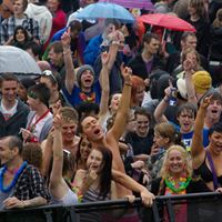 Soggy crowds enjoy the acts on the main stage.