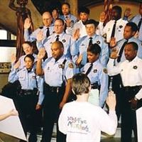 Scientologist Julie Brinker (far left) at 16, swearing in the  St. Louis Narcotics Division as Drug-Free Marshals