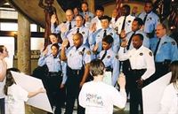 Scientologist Julie Brinker (far left) at 16, swearing in the  St. Louis Narcotics Division as Drug-Free Marshals