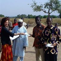 Scientologist Catherine Remise distributes copies of the nonreligious, common-sense moral code  The Way to Happiness in the village of Diokeli, Mali.