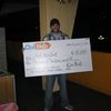 Winner Josh Neifert holding an oversized $10,000 check.