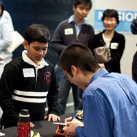 Richard Hoshino signing books for students