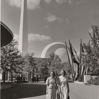 Two women in front of the Trylon and Perisphere