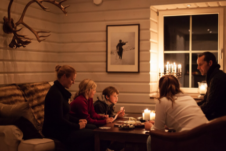 A group of people sitting around a table
AI-generated content may be incorrect.