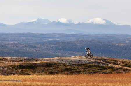 A person riding a bike on a hill
AI-generated content may be incorrect.