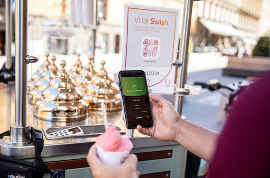 A person holding a phone and a cup of ice cream

AI-generated content may be incorrect.