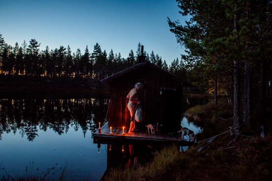 A person standing on a dock with dogs and candles

AI-generated content may be incorrect.
