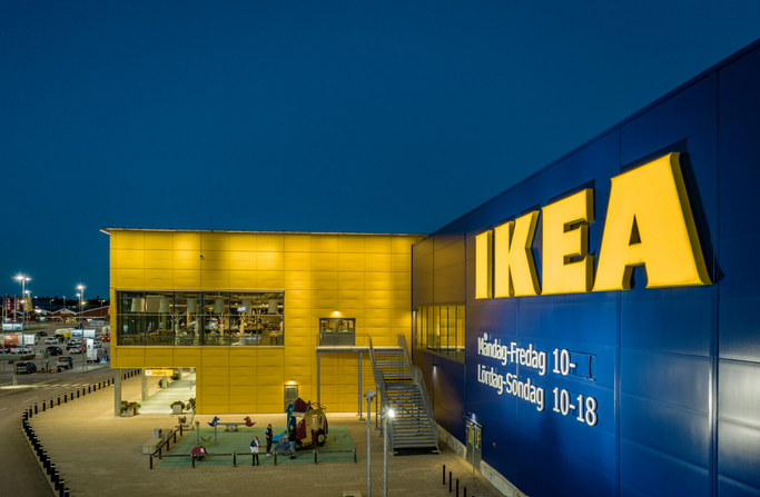 A large blue and yellow building with a sign
AI-generated content may be incorrect.