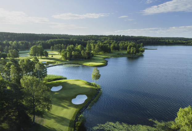 A golf course with water and trees
AI-generated content may be incorrect.