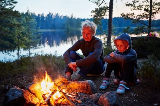A person and a child sitting by a campfire
AI-generated content may be incorrect.