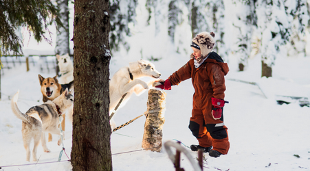 A person in snow with a dog
AI-generated content may be incorrect.