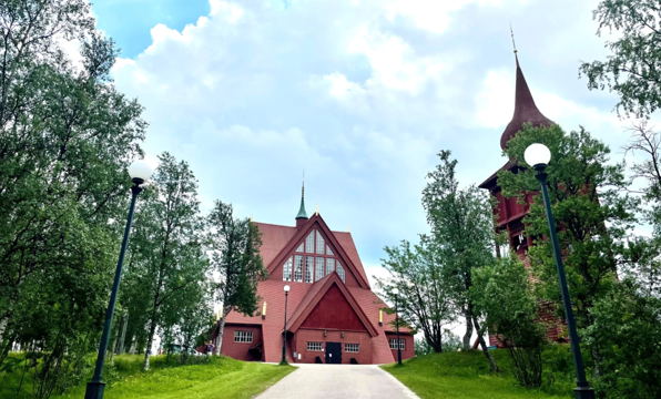 A building with a steeple and trees
AI-generated content may be incorrect.