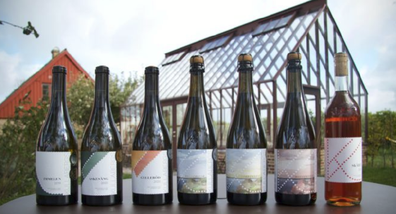 A row of wine bottles
AI-generated content may be incorrect.