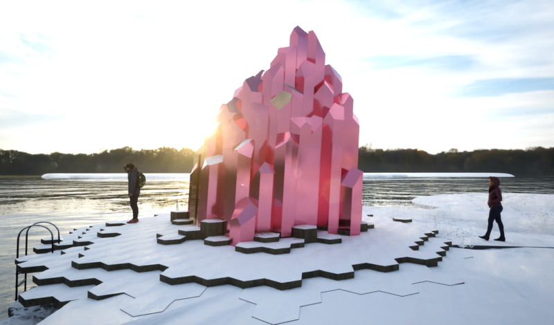 A person standing on a snow covered surface with a large pink crystal
AI-generated content may be incorrect.