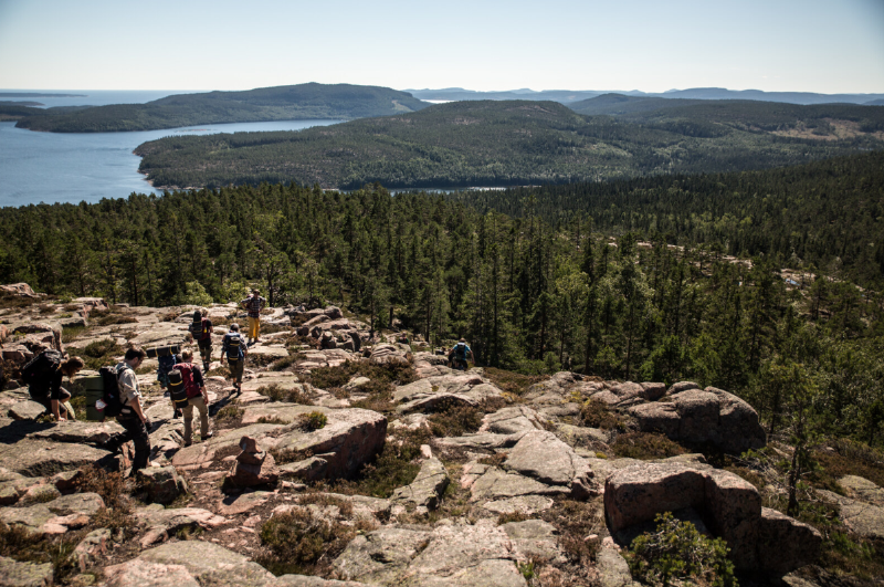 A group of people hiking on a rocky mountain
AI-generated content may be incorrect.