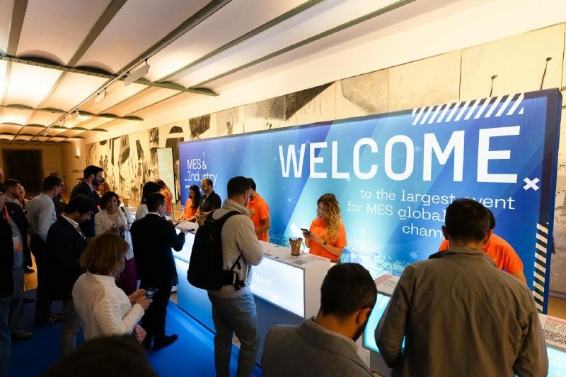 A group of people standing in front of a large sign

AI-generated content may be incorrect.