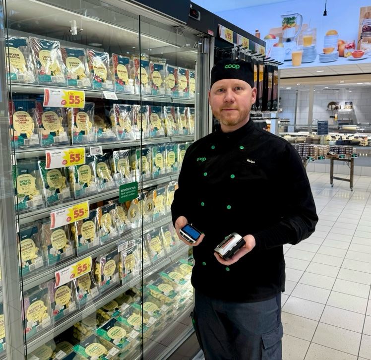 A person standing in front of a display of food
AI-generated content may be incorrect.