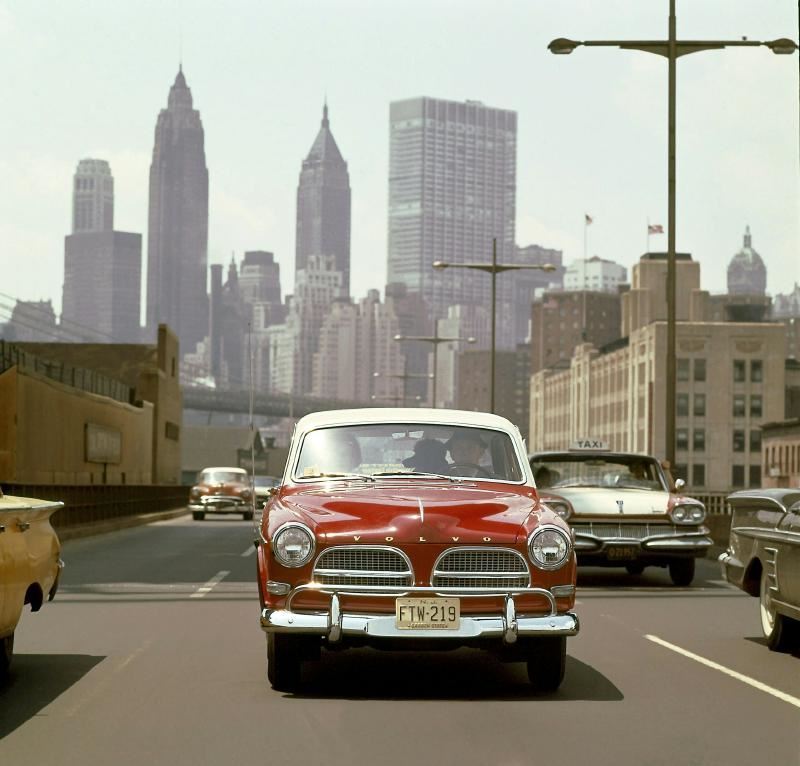 Front, A Swede in New York. A 1958 Volvo 122 "Amazon" caught in the middle of Manhattan traffic.