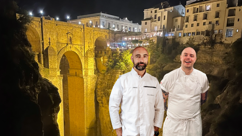 A group of men standing in front of a stone bridge
AI-generated content may be incorrect.